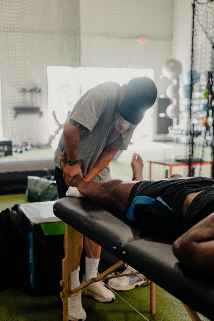 Dr. Alex Chau performing manual therapy